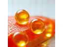 Capsules and fish oil, representing Omega-3s.